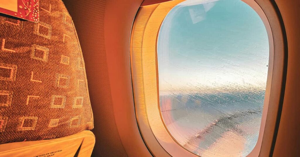 Airplane landing in Seychelles showing typical flight duration from Europe, Dubai and South Africa